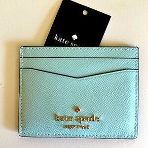 New Kate Spade Leather Blue Glow Card Holder with Gold Logo.